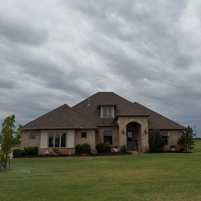 Brick home with arched entry, recent project