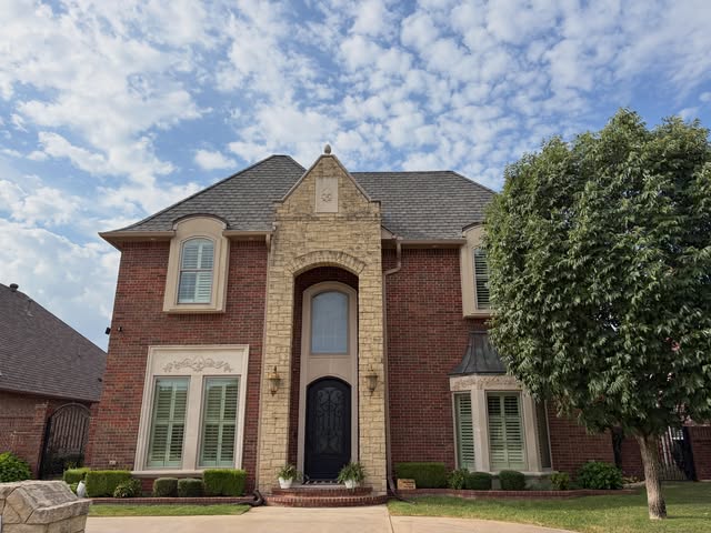 Two-story brick and stone home, recent project