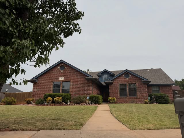 Brick home with landscaped front walk, recent project