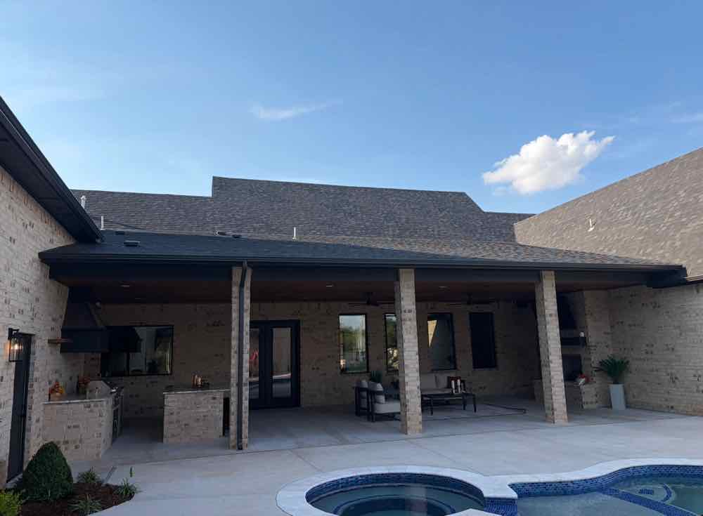 Back patio and pool of the showcase home